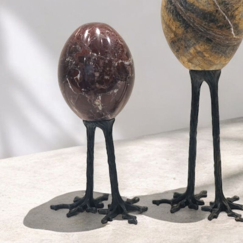 Whimsical egg-shaped stone decor on bird-like legs, perfect for adding charm to any space. A unique piece by Styles Asia Home