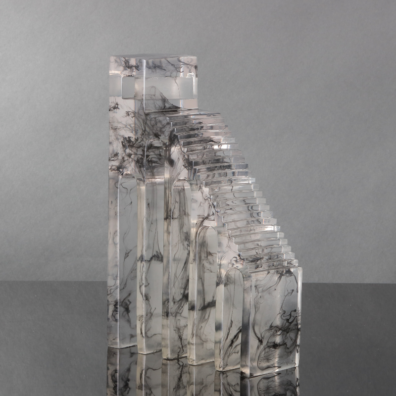 A reimagination of the famous Roman coliseums. Transparent epoxy resin with a marbled inked pattern.